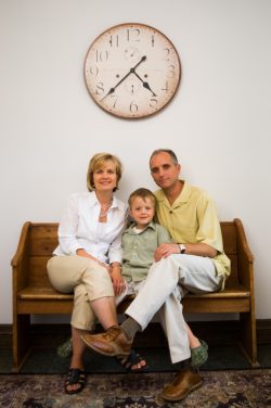 In home Family Portrait  sitting on a bench
