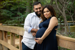Outdoor portait of an expectant mother and father
